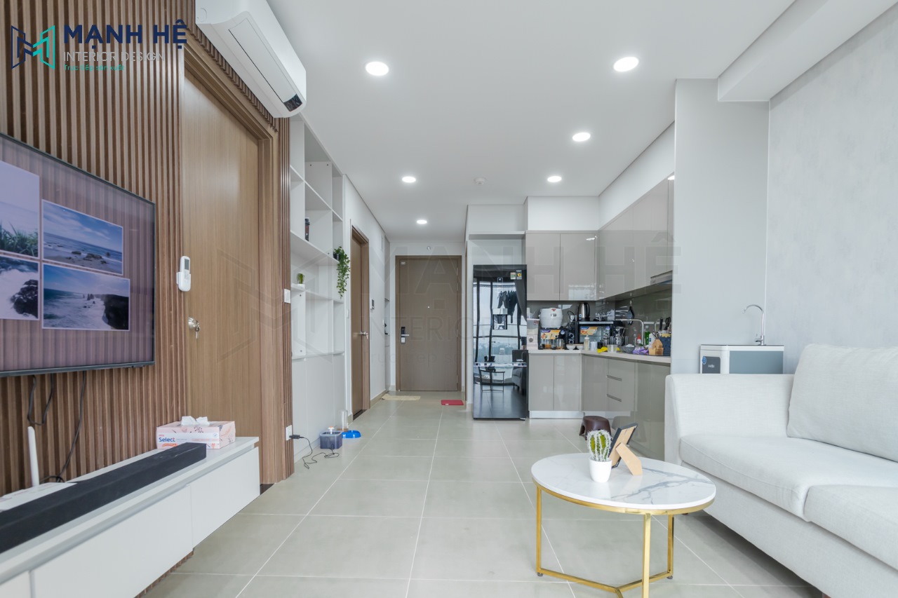 Tổng quan không gian thi công thực tế phòng khách liền bếp căn hộ chung cư