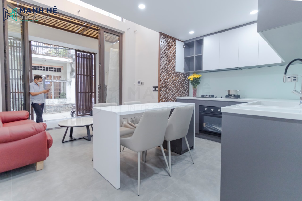 Bàn ăn mặt đá còn có công dụng khác là làm bàn đảo bếp