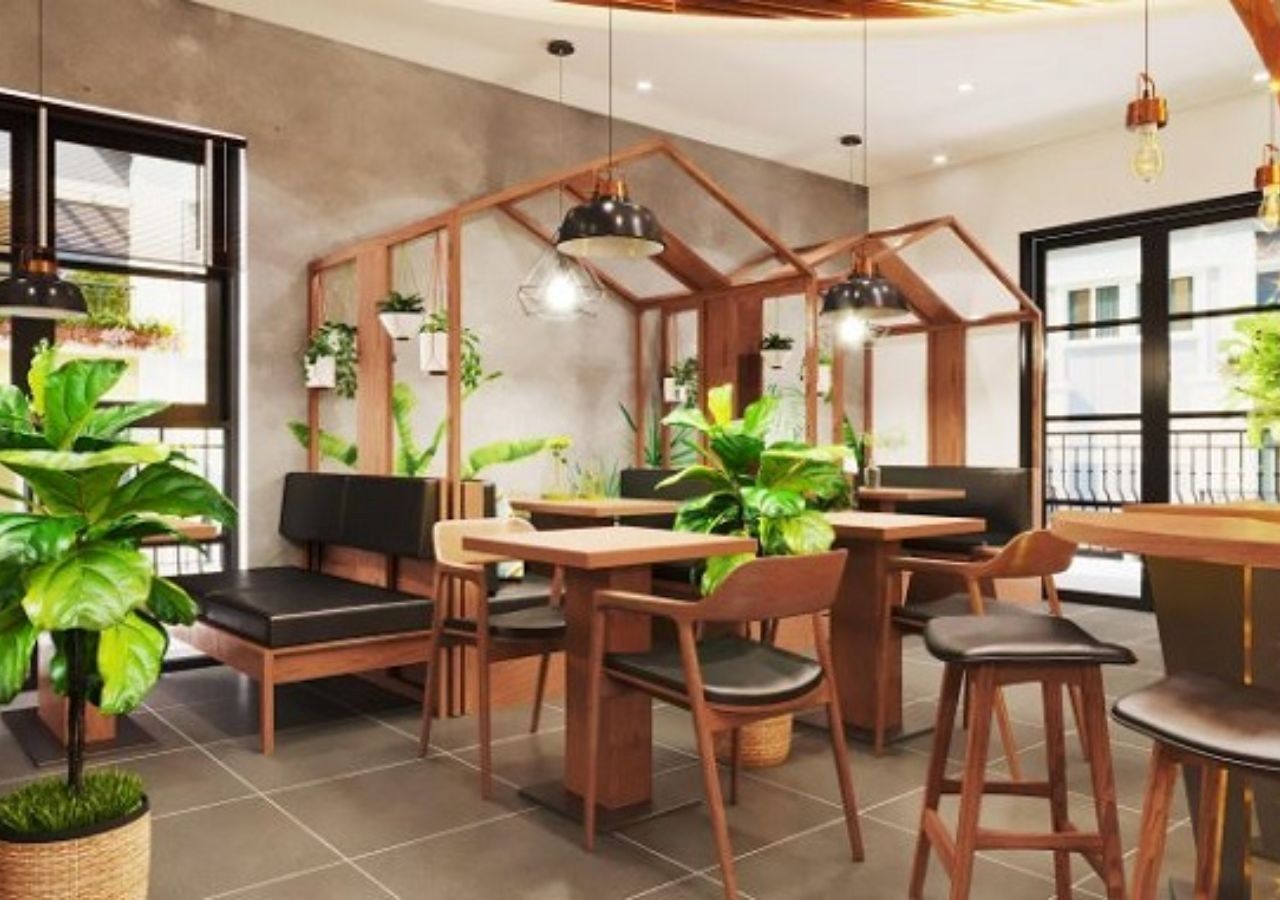 Ý tưởng 6: Nội thất gỗ kết hợp cây trang trí quán cafe mang lại cảm giác thân thiện