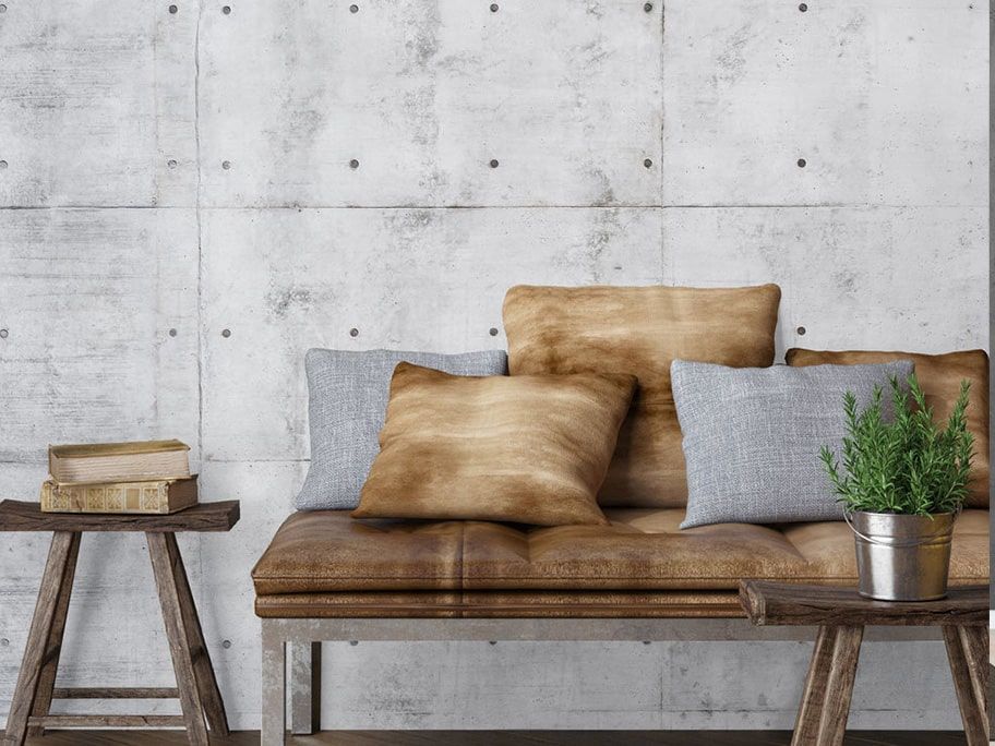 Giấy dán tường giả bê tông đẹp, hài hoàn với tông màu nâu của ghế sofa