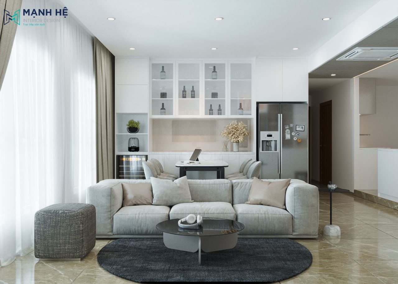 Bố trí ghế sofa đặt chính giữa trung tâm phòng khách, thêm ghế đôn và thảm lót