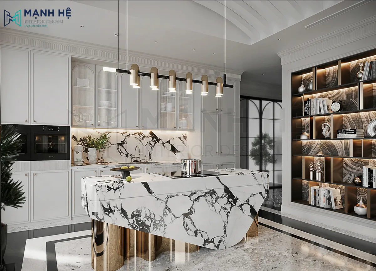 Không gian phòng bếp căn hộ duplex mang vẻ đẹp trang nhã, sang trọng với các chi tiết trang trí ánh kim và phần vách bếp và bàn đảo đều được ốp đá granite tạo sự đồng bộ