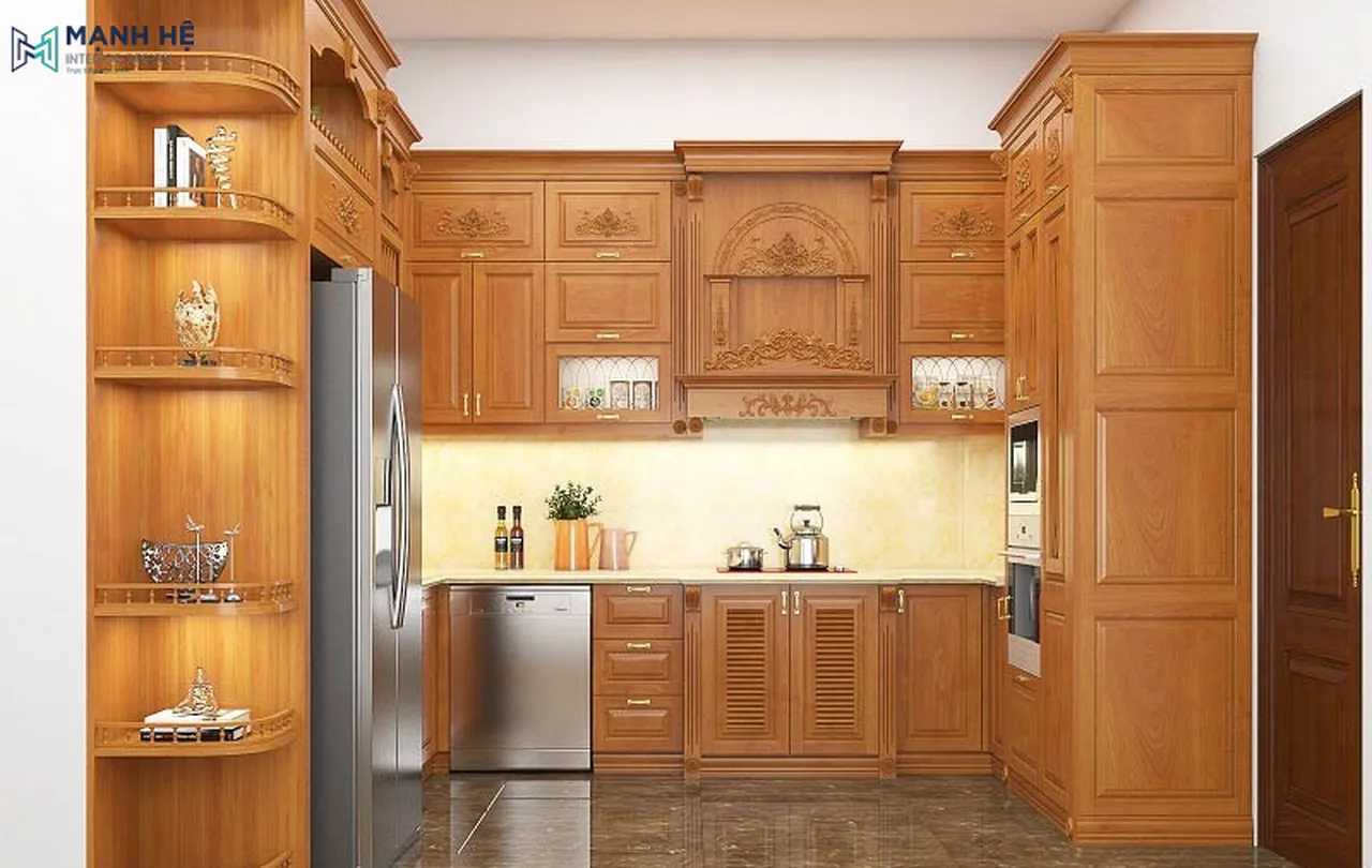 Thiết kế tủ bếp với các đường nét chạm khắc tinh xảo, cổ điển, kết hợp thêm kệ trang trí cho không gian thêm phần sinh động