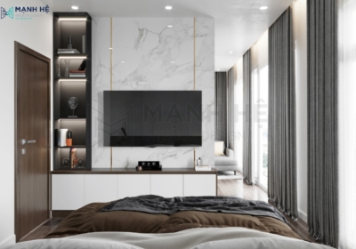 Vách ốp đá tự nhiên kết hợp nẹp vàng là điểm nhấn nổi bật cho hệ tủ kệ tivi tích hợp kệ trang trí trong phòng ngủ master