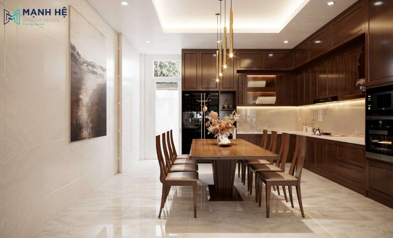 Giữa phòng bếp đặt bàn ăn 8 ghế bằng gỗ tự nhiên sử dụng hệ đèn thả trang trí cho góc nhỏ thêm sang trọng