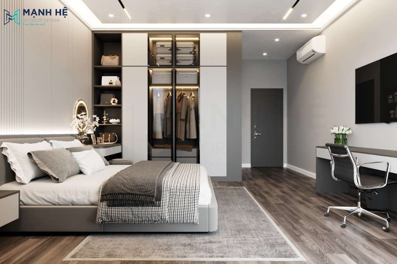 Hệ tủ quần áo cánh kính kết hợp kệ trang trí và bàn trang điểm giúp phòng ngủ master hiện đại càng thêm sang trọng, đẳng cấp