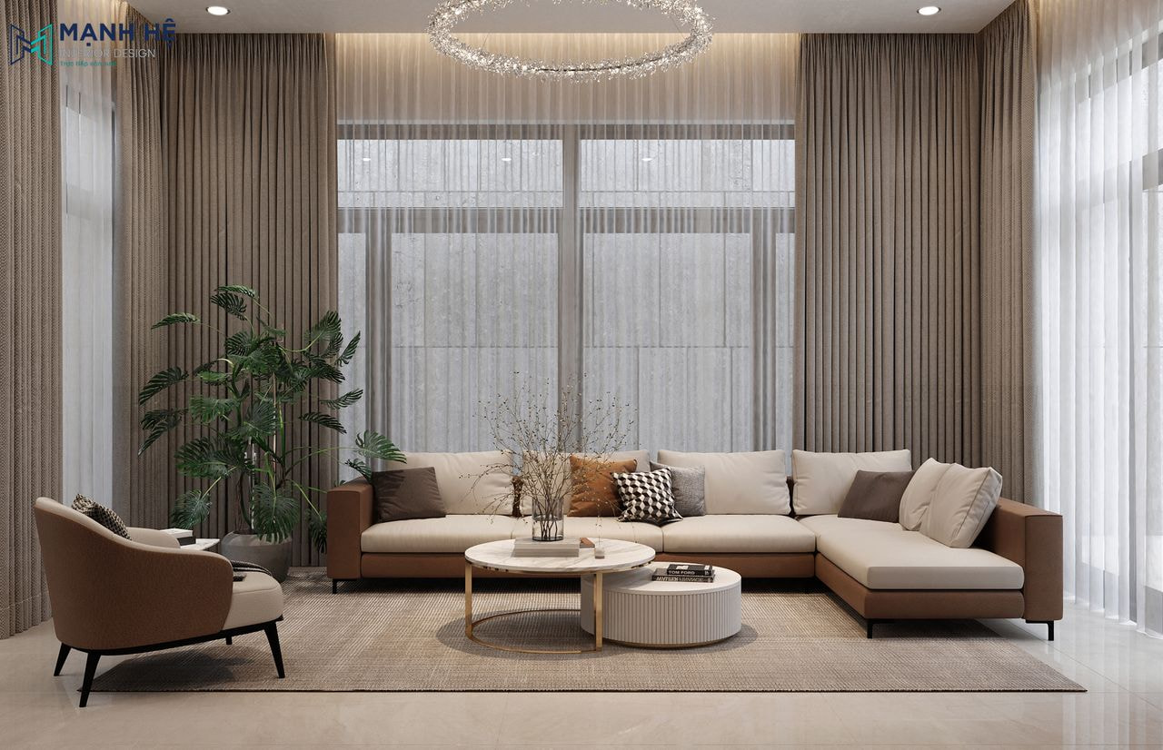 Không gian phòng khách sang trọng với thiết kế sofa chữ L bọc nệm êm ái kêt hợp cùng hệ rèm 2 lớp làm tăng thẩm mỹ cho căn phòng khách