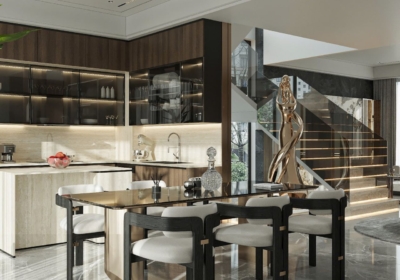 Hệ tủ bếp chữ L trong villa hiện đại sử dụng hai tông màu nâu phối hợp, kết hợp mặt đá sáng và đảo bếp nhỏ gọn, tạo điểm nhấn thẩm mỹ và chiều sâu cho gian bếp